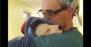 Assistant Vet Comforts Rescued Dog After Surgery