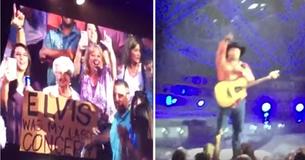 Garth Brooks afgeleid door vrouw met bord, leest het en loopt meteen van het podium af