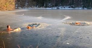 Man And His Dog Leap Into Water To Save Pups Trapped In Icy Lake