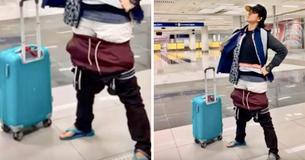Eine Flug-Passagierin zieht alle ihre Kleidung an, um darum herumzukommen, Übergepäck zu bezahlen