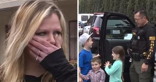 Des policiers aident une famille de quatre qui vit derrière un magasin