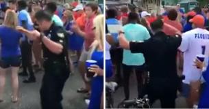 Un policier regrette de ne pas pouvoir se joindre à la fête en attendant la musique Cupid Shuffle