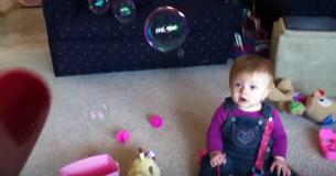 Mom Blows Bubbles Into Room, Baby Reacts Delighted