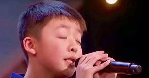 Simon Cowell a promis un chien à un jeune garçon, Jeffrey Li, avant sa performance sur "You raise me up" dans "America's got talent"
