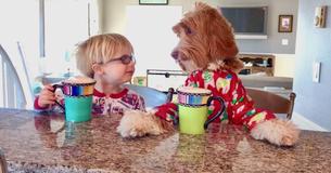 Pajama-Wearing Boy And Dog’s Morning Routine Is A Great Start To The Day