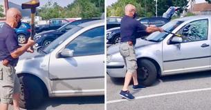 Man gebruikt bijl om autoruit te breken en hond te redden die door eigenaar te midden van een hittegolf van 36 graden in hete auto is achtergelaten