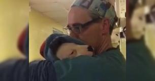 Vet Cradles Scared Rescue Puppy Like A Baby After Surgery
