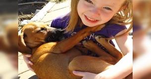 Girl Gently Sings Her New Rescue Puppy To Sleep