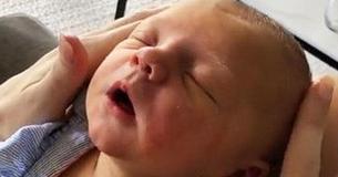 Newborn Baby Enjoys Receiving Peaceful Face Massage