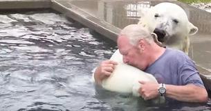 Man Swims Together With White Polar Bear He Has Raised For More Than Two Decades