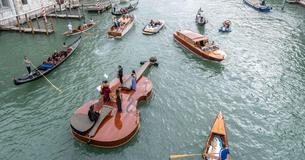 A Massive 12-Meter Violin Boat Just Sailed Through The Canals Of Venice