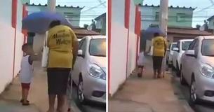 4-Year-Old Boy Sees Elderly Woman Walking In The Rain, Rushes To Help