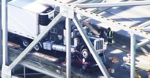 Woman Survives Car Crash With Semi-Truck, Crawls Out of Window