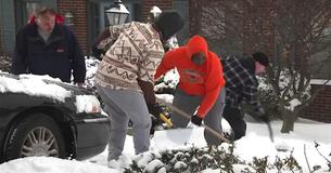 Football Players Help Elderly And Disabled Residents Shovel Driveways After Coach Comes Up With New 'Monday Workout'