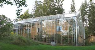 Couple Stays Warm And Grows Food Thanks To Greenhouse They Built Around Their Home