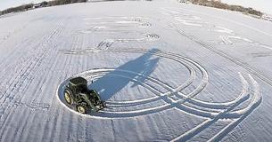 Farmer Rings In The Season By Using Tractor To Carve Holiday Message In The Snow