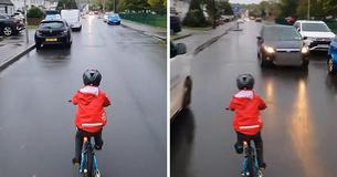 Vater schimpft über Autofahrer, der sich auf der Straße an seinem radelnden 5-jährigen Kind vorbeidrängt