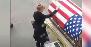 Woman Is Guided Off Plane To Her Husband’s Casket Without Knowing She’s Being Recorded