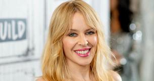 Kylie Minogue Shows Off Her Curves In Sultry Swimsuit & Stilettos For Photoshoot