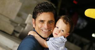 At 60, John Stamos Is Right Where He’s ‘Supposed To Be’ – With Wife Caitlin & Son Billy
