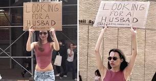 Woman Fed Up With Dating Apps Looks For A Husband By Walking On The Streets With A Cardboard Sign
