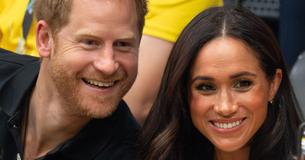 Prince Harry & Meghan Markle Caught Sharing Tender Kiss Among Audience At Games Ceremony