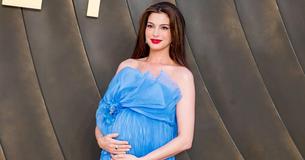 Anne Hathaway Cradles Her Baby Bump at "The Odyssey" Premiere in a Dior Gown